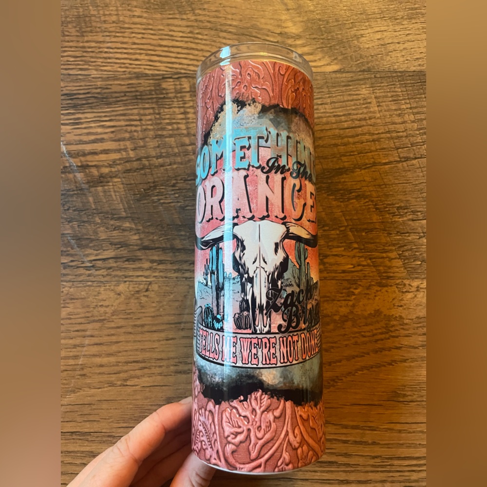 Something in the orange Zach Bryan coffee cup *hand made but not by me